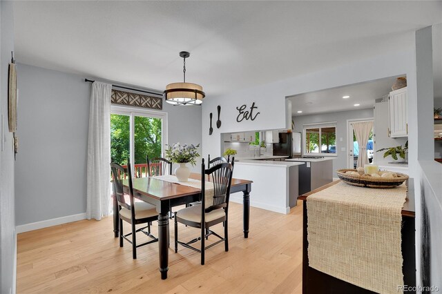 9880 E 157th Ave, Brighton, CO 80602 - dining space with healthy amount of natural light, light wood finished floors, recessed lighting, and baseboards