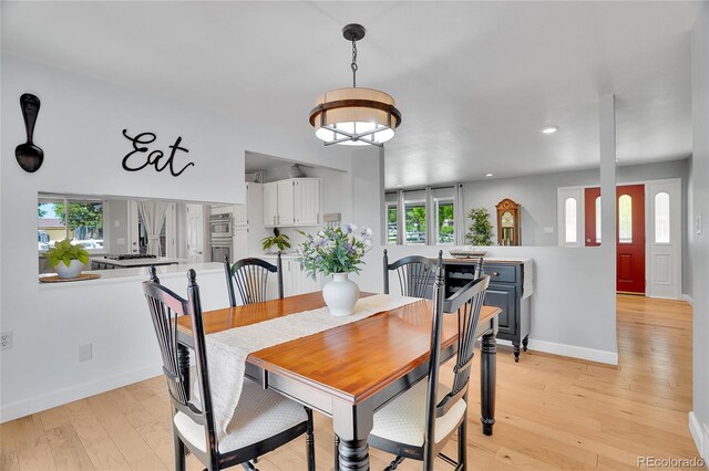 9880 E 157th Ave, Brighton, CO 80602 - dining space with light wood-style flooring, healthy amount of natural light, recessed lighting, and baseboards
