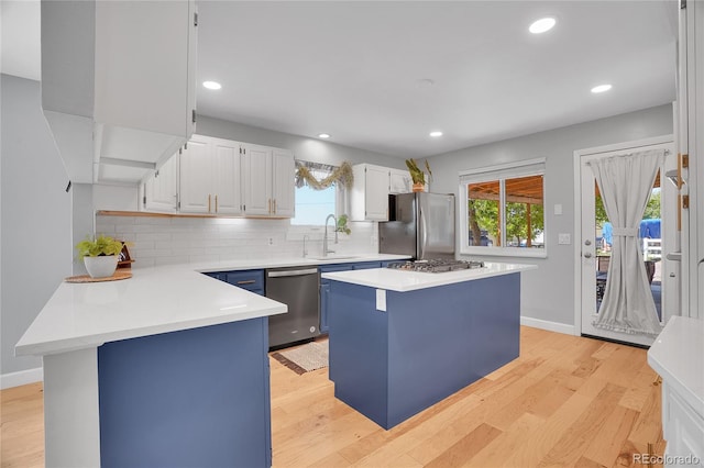 9880 E 157th Ave, Brighton, CO 80602 - kitchen featuring stainless steel appliances, light wood-style floors, light countertops, tasteful backsplash, and recessed lighting