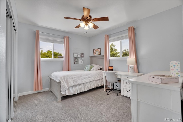 9880 E 157th Ave, Brighton, CO 80602 - bedroom featuring light colored carpet, multiple windows, and an office area