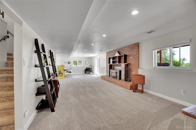 9880 E 157th Ave, Brighton, CO 80602 - unfurnished living room with carpet, baseboards, stairway, recessed lighting, and a brick fireplace