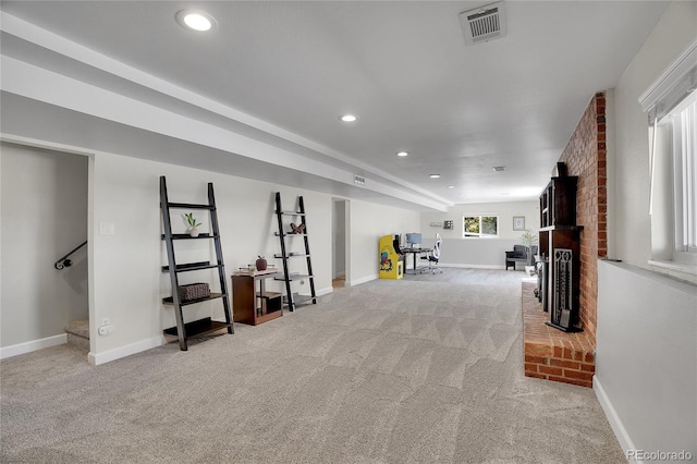 9880 E 157th Ave, Brighton, CO 80602 - below grade area with light colored carpet, recessed lighting, baseboards, and a brick fireplace