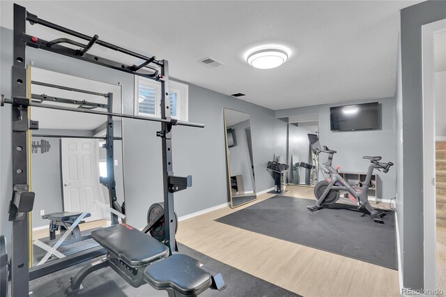 9880 E 157th Ave, Brighton, CO 80602 - workout room featuring wood finished floors and baseboards