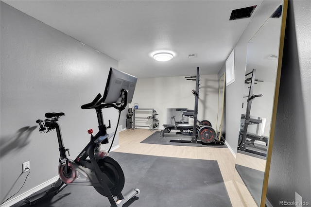9880 E 157th Ave, Brighton, CO 80602 - exercise room featuring wood finished floors and baseboards