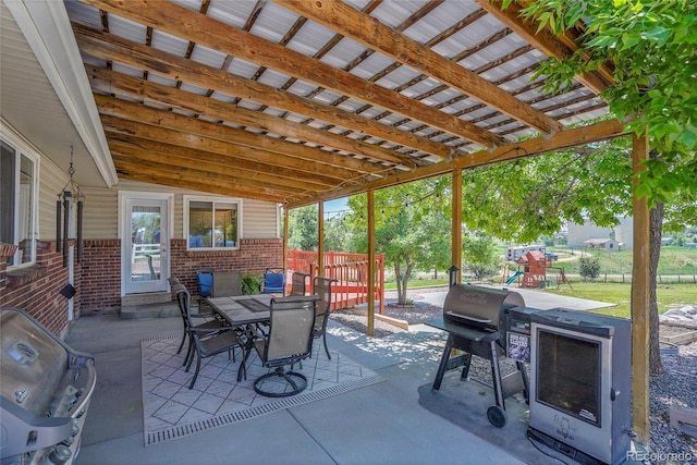 9880 E 157th Ave, Brighton, CO 80602 - view of patio with outdoor dining area, a playground, and area for grilling