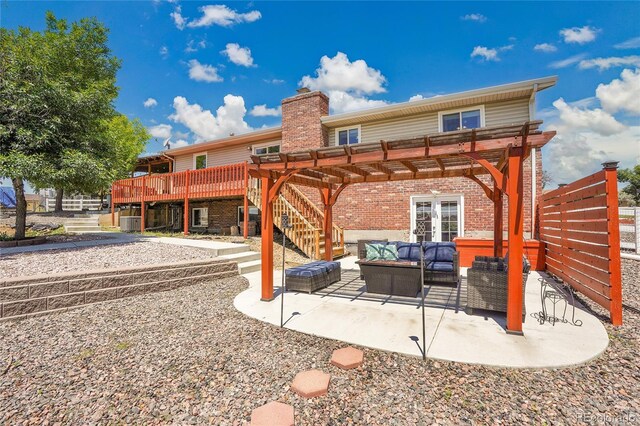 9880 E 157th Ave, Brighton, CO 80602 - back of property featuring an outdoor hangout area, brick siding, french doors, a patio area, and a chimney