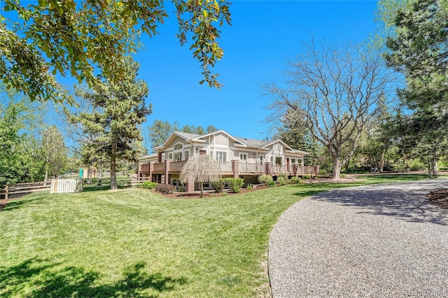view of front of house featuring a wooden deck and driveway