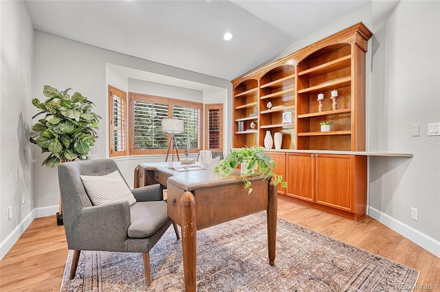 home office with light wood-type flooring, baseboards, lofted ceiling, and recessed lighting