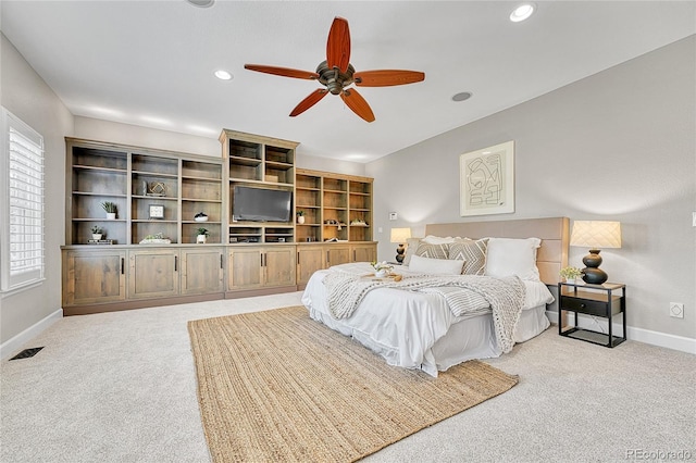 bedroom featuring light carpet, baseboards, recessed lighting, and ceiling fan