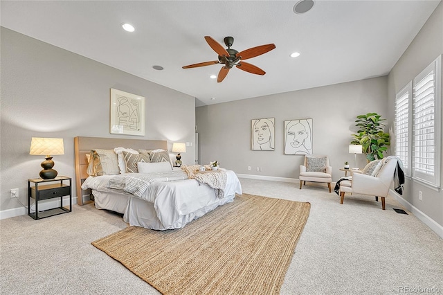 bedroom with light colored carpet, baseboards, recessed lighting, and ceiling fan