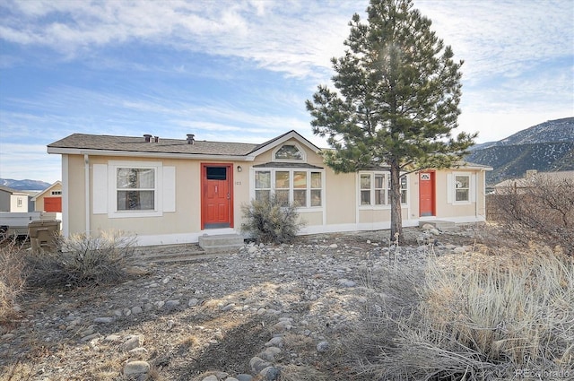 ranch-style house with a mountain view