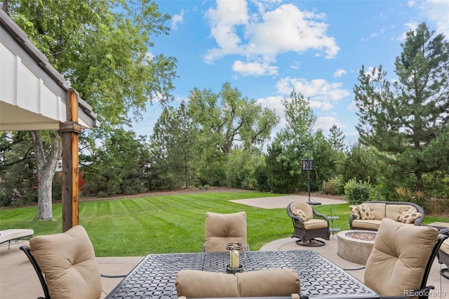 view of yard with a patio area and an outdoor living space with a fire pit