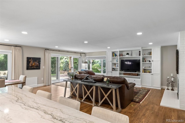 560 Front Range Rd, Littleton, CO 80120 - living room with baseboards, recessed lighting, wood finished floors, and a wealth of natural light