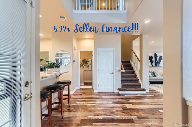 entrance foyer with dark hardwood / wood-style flooring