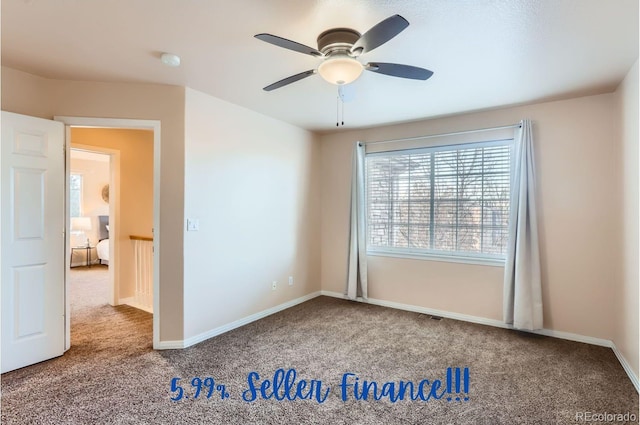 unfurnished room with ceiling fan and carpet floors