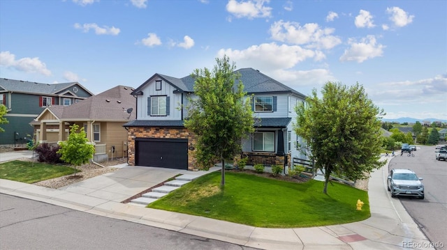 5021 S Rome St, Aurora, CO 80015 - view of front of home featuring stone siding, an attached garage, driveway, a front lawn, and board and batten siding