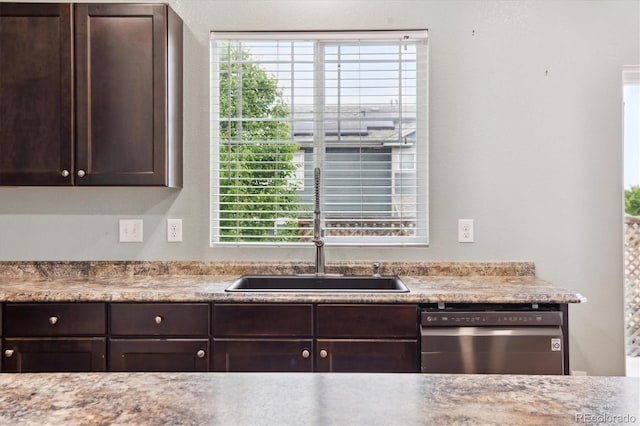 5021 S Rome St, Aurora, CO 80015 - kitchen with stainless steel dishwasher, a sink, dark brown cabinetry, and plenty of natural light