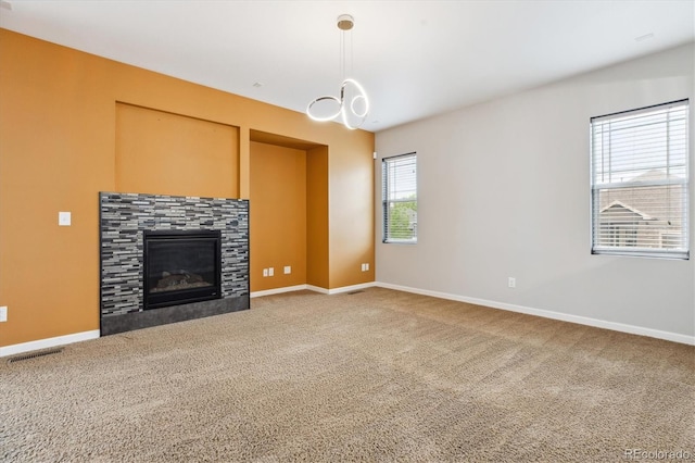5021 S Rome St, Aurora, CO 80015 - unfurnished living room with a fireplace, carpet flooring, and baseboards