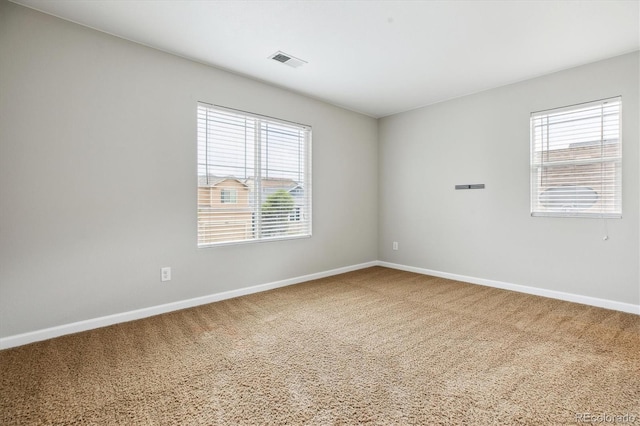 5021 S Rome St, Aurora, CO 80015 - unfurnished room featuring baseboards, healthy amount of natural light, and carpet