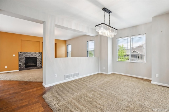 5021 S Rome St, Aurora, CO 80015 - unfurnished room with a chandelier, healthy amount of natural light, and baseboards