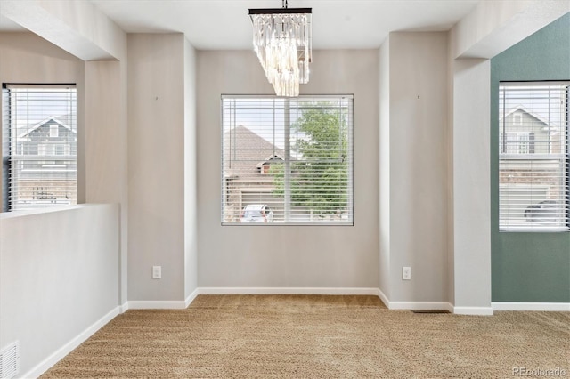 5021 S Rome St, Aurora, CO 80015 - unfurnished dining area with carpet, a chandelier, and baseboards