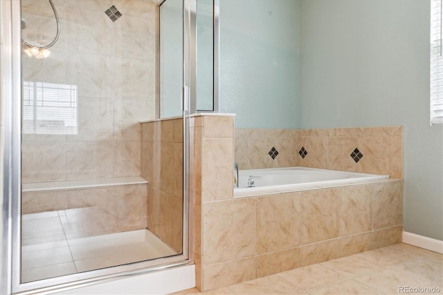 5021 S Rome St, Aurora, CO 80015 - bathroom with a stall shower, a garden tub, and tile patterned flooring