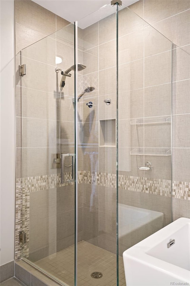 bathroom featuring separate shower and tub