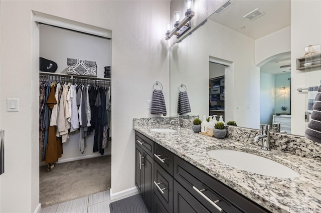 12910 Grant Cir W Unit C, Thornton, CO 80241 - full bath with double vanity and a spacious closet