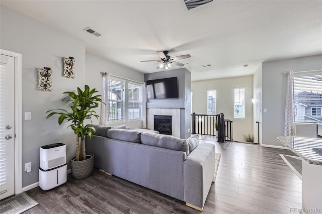 12910 Grant Cir W Unit C, Thornton, CO 80241 - living area with healthy amount of natural light, ceiling fan, and dark wood-type flooring