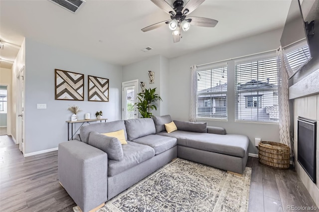 12910 Grant Cir W Unit C, Thornton, CO 80241 - living area featuring wood finished floors, ceiling fan, and healthy amount of natural light