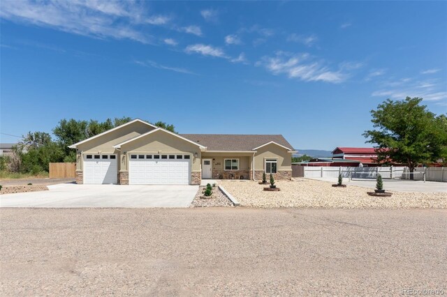 ranch-style home featuring a garage