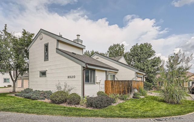 view of home's exterior featuring a lawn