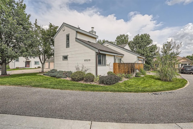 view of home's exterior featuring a yard