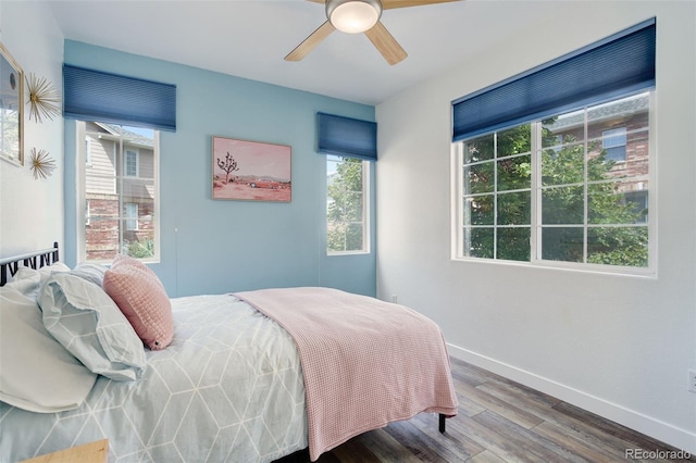 bedroom featuring wood-type flooring and ceiling fan