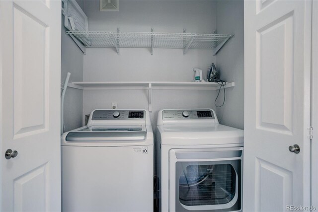 washroom featuring separate washer and dryer