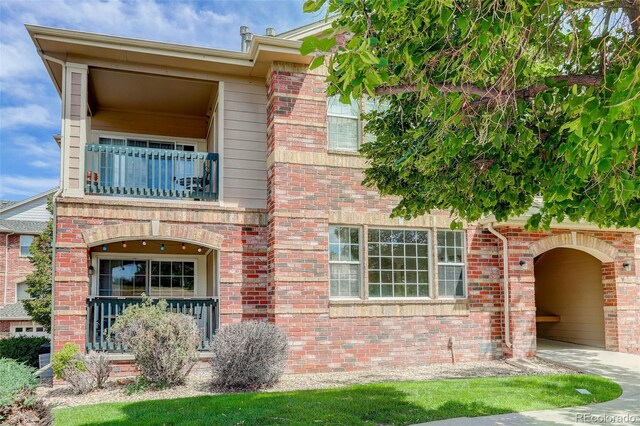 view of front of home with a balcony