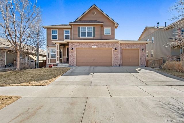 view of front of home featuring a garage, concrete driveway, and brick siding