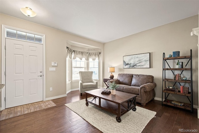 living area with dark wood-style floors and baseboards