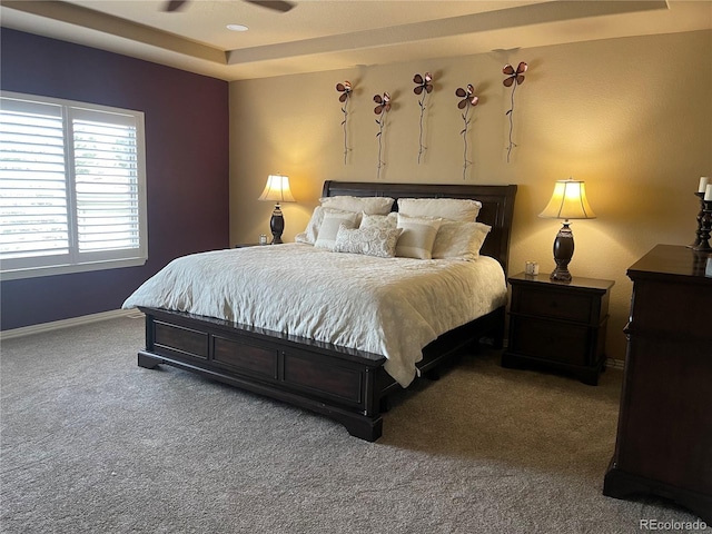 6405 Eagle Feather Trl, Littleton, CO 80125 - carpeted bedroom with a tray ceiling and baseboards