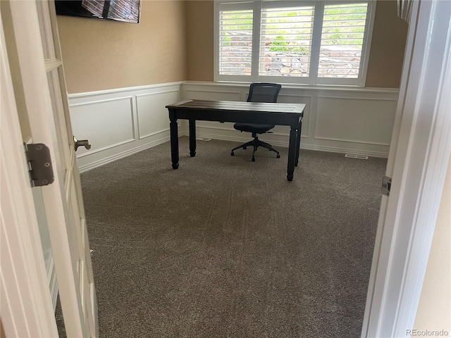 6405 Eagle Feather Trl, Littleton, CO 80125 - carpeted home office with a decorative wall and a wainscoted wall