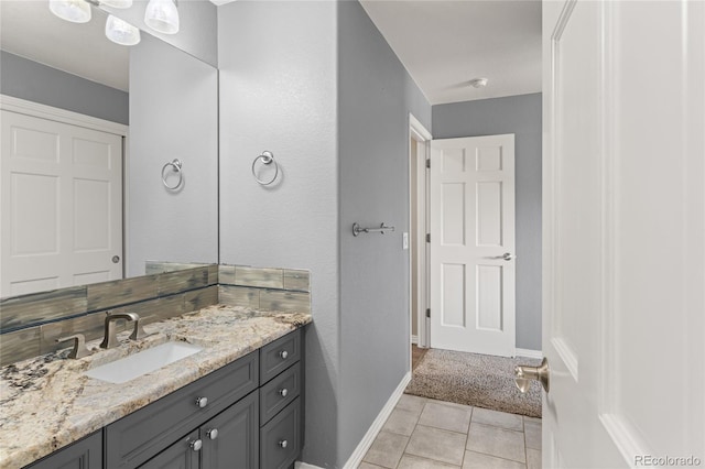 6405 Eagle Feather Trl, Littleton, CO 80125 - bathroom featuring vanity, baseboards, and tile patterned flooring