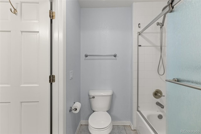 6405 Eagle Feather Trl, Littleton, CO 80125 - bathroom with baseboards, toilet, tile patterned flooring, and washtub / shower combination