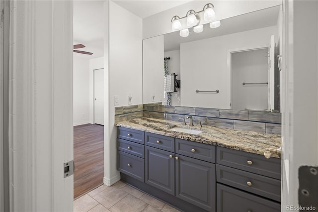 6405 Eagle Feather Trl, Littleton, CO 80125 - bathroom featuring vanity, tile patterned flooring, and baseboards