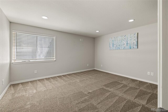 6405 Eagle Feather Trl, Littleton, CO 80125 - spare room featuring carpet floors, recessed lighting, and baseboards