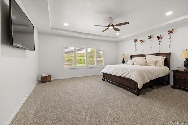 6405 Eagle Feather Trl, Littleton, CO 80125 - carpeted bedroom with baseboards, recessed lighting, a tray ceiling, and a ceiling fan