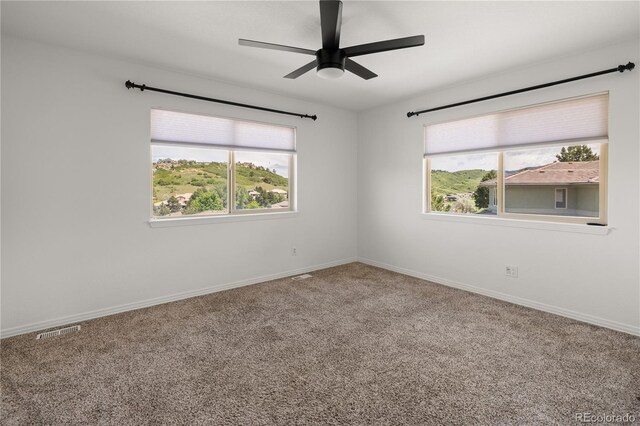 6405 Eagle Feather Trl, Littleton, CO 80125 - carpeted empty room featuring ceiling fan and baseboards