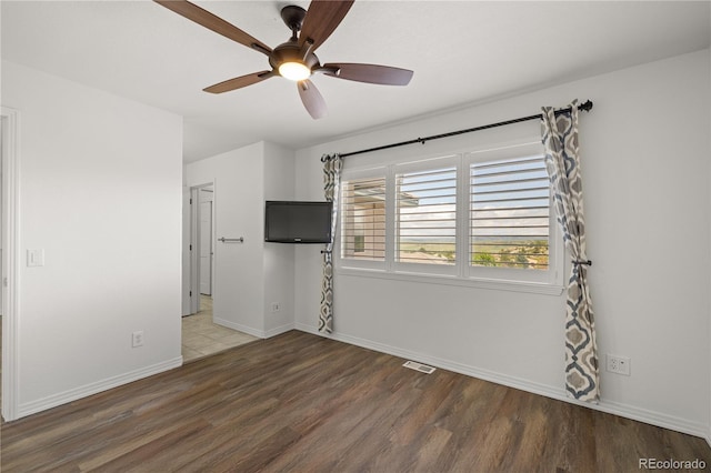 6405 Eagle Feather Trl, Littleton, CO 80125 - unfurnished room featuring wood finished floors, ceiling fan, and baseboards