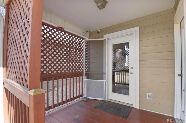 view of exterior entry with covered porch