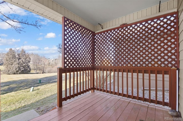 wooden deck with a yard