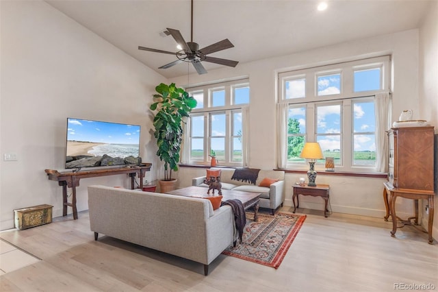 11881 County Road 37, Fort Lupton, CO 80621 - living area featuring wood finished floors, ceiling fan, and lofted ceiling